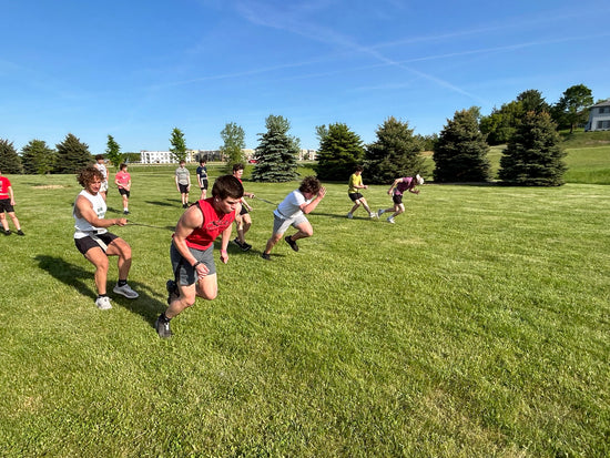 Football players speed training using elastic cords