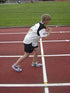 youth track runner at the starting line